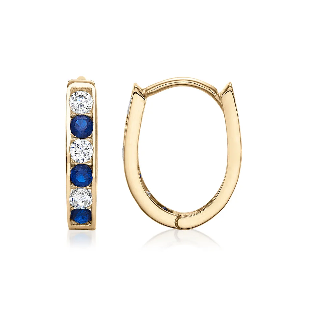 Round Brilliant hoop earrings with ceylon sapphire and diamond simulants in 10 carat yellow gold